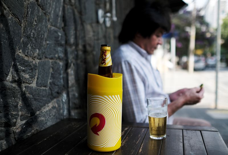 &copy; Reuters. FILE PHOTO: A bottle of beer is seen next to a man on the terrace of a bar in Sao Paulo, Brazil July 25, 2018. REUTERS/Nacho Doce