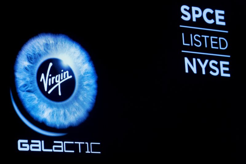 © Reuters. FILE PHOTO: Virgin Galactic (SPCE) logo is displayed on a screen on the floor of the New York Stock Exchange (NYSE) as the company begins public trading in New York, U.S., October 28, 2019. REUTERS/Brendan McDermid