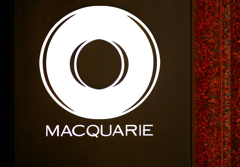 Australia's Macquarie has record year but profit warning triggers share slide