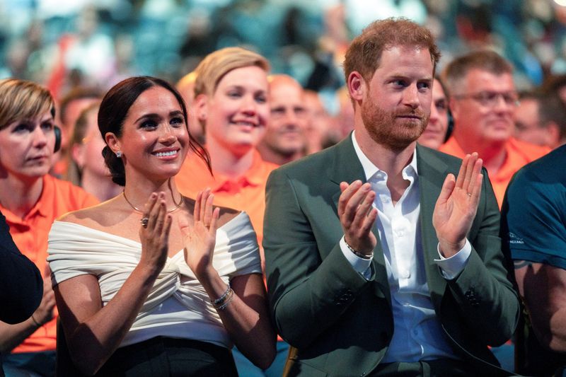 &copy; Reuters. FILE PHOTO: Britain's Prince Harry and Meghan, Duchess of Sussex, attend the opening ceremony of the Invictus Games in The Hague, Netherlands April 16, 2022. Peter Dejong/Pool via REUTERS