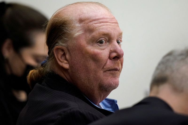 © Reuters. Celebrity chef Mario Batali is seated at Boston Municipal Court during the first day of his trial on a criminal charge that he forcibly groped and kissed a woman at a restaurant in 2017, in Boston, Massachusetts, U.S. May 9, 2022. Steven Senne/Pool via REUTERS