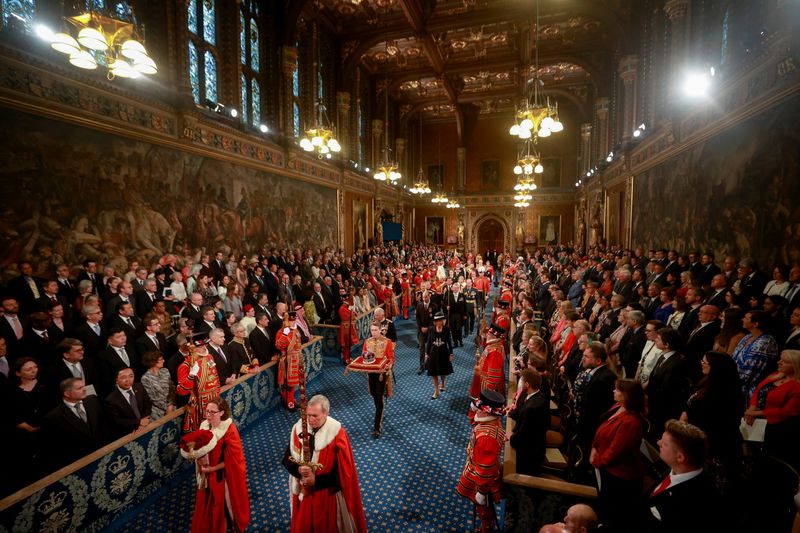 &copy; Reuters. Britain's Prince Charles, Camilla, Duchess of Cornwall, and Prince William proceed behind the Imperial State Crown through the Royal Gallery for the State Opening of Parliament at the Palace of Westminster in London, Britain, May 10, 2022. REUTERS/Hannah 