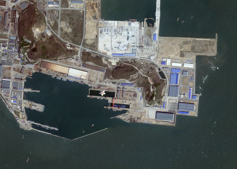 © Reuters. A satellite image taken by Planet Labs show a dry dock in Huludao Port in Liaoning province, China, May 4, 2022. Planet Labs PBC/Handout 