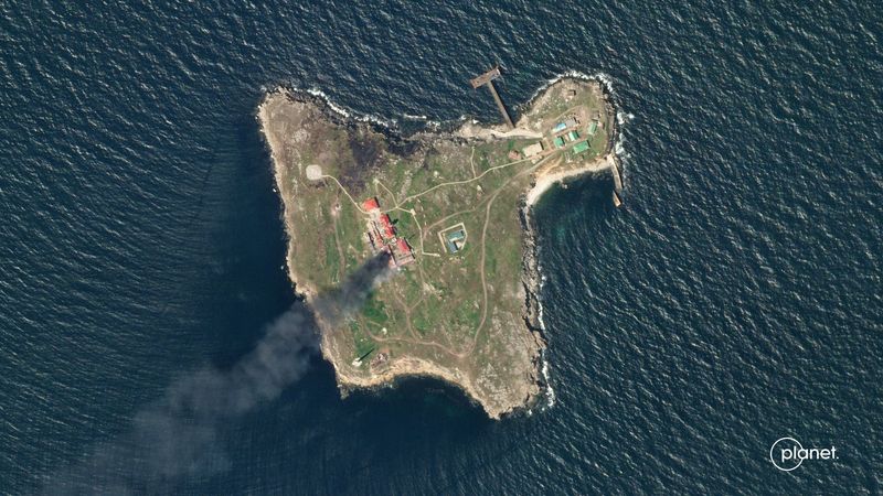 &copy; Reuters. FILE PHOTO: Satellite view shows smoke rising over Snake Island, Ukraine amid Russia's attack on the country, May 6, 2022 in this handout image. Planet Labs PBC/Handout via REUTERS/File Photo