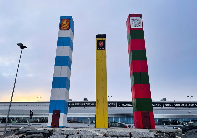 &copy; Reuters. The border posts of Finland (blue and white), Norway (black and yellow) and Russia (red and green), stand outside the airport of the Norwegian Arctic town of Kirkenes, Norway, May 8, 2022. REUTERS/Gwladys Fouche
