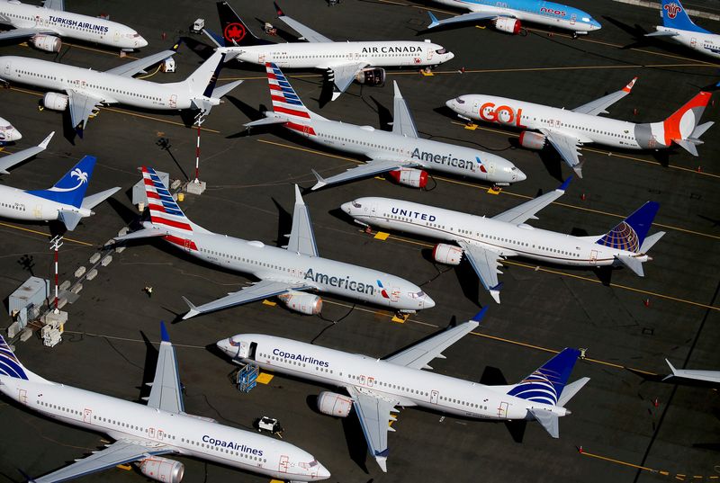 © Reuters. FILE PHOTO: Grounded Boeing 737 MAX aircraft are seen parked in an aerial photo at Boeing Field in Seattle, Washington, U.S. July 1, 2019.REUTERS/Lindsey Wasson/File Photo/File Photo