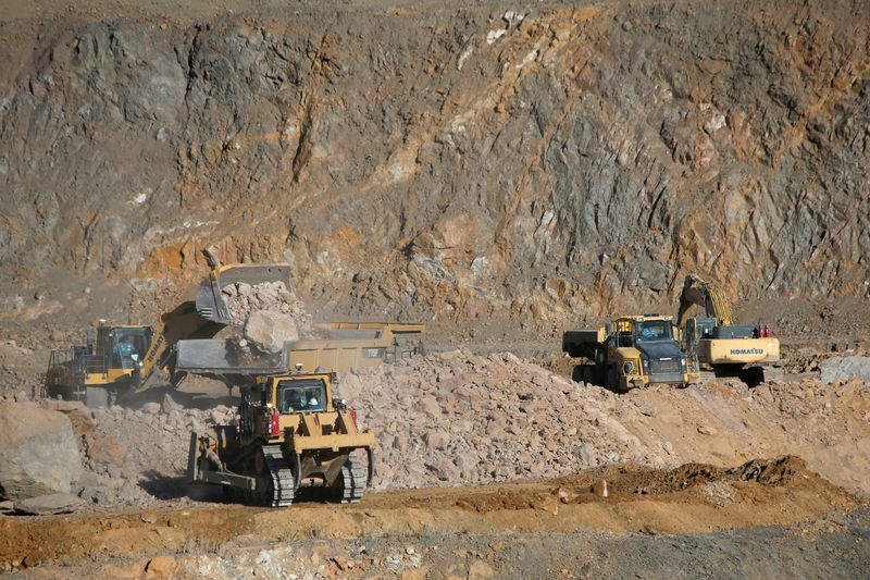 &copy; Reuters. FILE PHOTO: Wheel loaders fill trucks with ore at the MP Materials rare earth mine in Mountain Pass, California, U.S. January 30, 2020. REUTERS/Steve Marcus/File Photo/File Photo