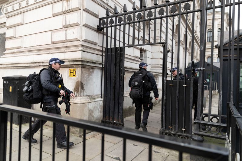 &copy; Reuters. FILE PHOTO: Police officers walk towards Downing Street, in London, Britain February 12, 2022. REUTERS/May James