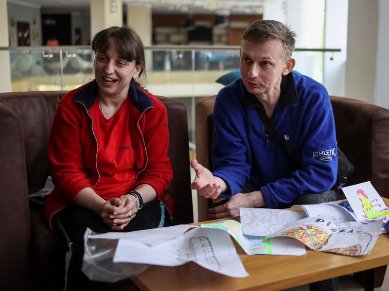 &copy; Reuters. Nataliya and Volodymyr Babeush, who were evacuated from Azovstal plant in Mariupol, amid Russia's invasion in Ukraine, speak during an interview with Reuters in Zaporizhzhia, Ukraine May 9, 2022. Picture taken May 9, 2022.  REUTERS/Gleb Garanich