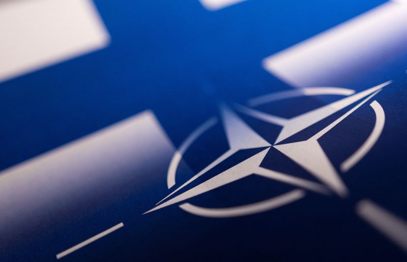 &copy; Reuters. FILE PHOTO: Finnish and NATO flags are seen printed on paper this illustration taken April 13, 2022. REUTERS/Dado Ruvic/Illustration