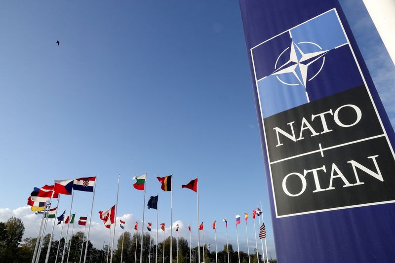 &copy; Reuters. FILE PHOTO: Flags wave outside the Alliance headquarters ahead of a NATO Defence Ministers meeting, in Brussels, Belgium, October 21, 2021. REUTERS/Pascal Rossignol/File Photo