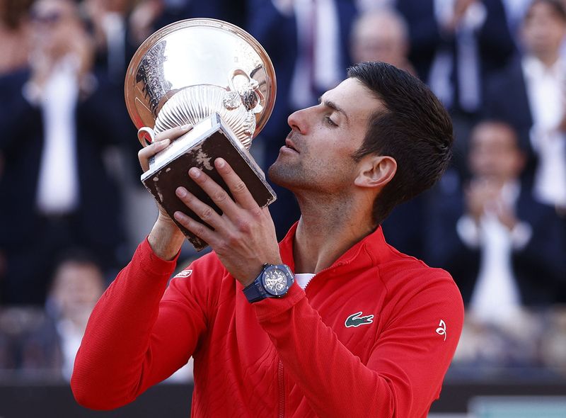 &copy; Reuters. Tennis - ATP Masters 1000 - Italian Open - Foro Italico, Rome, Italy - May 15, 2022 Serbia's Novak Djokovic celebrates with the trophy after winning the final against Greece's Stefanos Tsitsipas REUTERS/Guglielmo Mangiapane