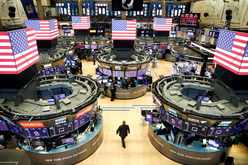 &copy; Reuters. FILE PHOTO: Traders work on the floor of the New York Stock Exchange in New York, U.S., March 16, 2020. REUTERS/Lucas Jackson/File Photo
