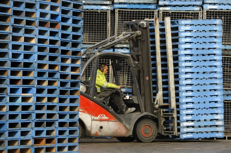 &copy; Reuters. FILE PHOTO: A forklift operator moves a stack of pallets at a Brambles-owned CHEP pallet depot in Sydney April 18, 2008. REUTERS/Tim Wimborne 