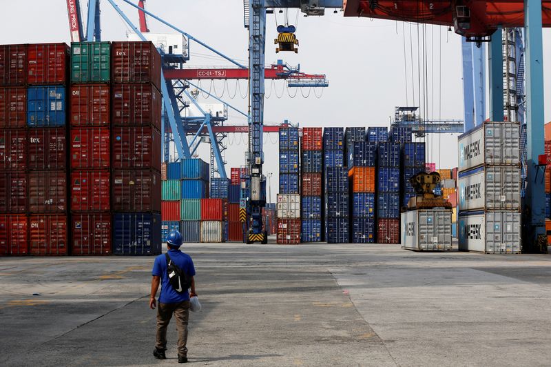 &copy; Reuters. A worker walks on the dock of the Tanjung Priok Port in Jakarta, Indonesia April 16, 2018.   REUTERS/Darren Whiteside/Files