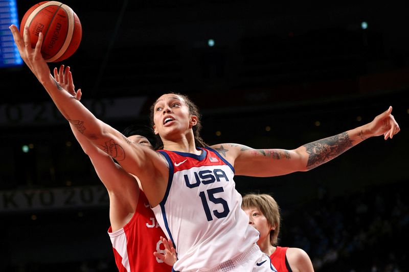 &copy; Reuters. FILE PHOTO: Tokyo 2020 Olympics - Basketball - Women - Gold medal match - United States v Japan - Saitama Super Arena, Saitama, Japan - August 8, 2021. Brittney Griner of the United States in action with Himawari Akaho of Japan REUTERS/Brian Snyder/File P