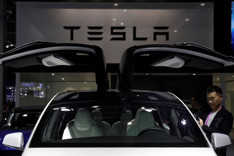 &copy; Reuters. A Tesla sign is seen at the second China International Import Expo (CIIE) in Shanghai, China November 5, 2019. REUTERS/Aly Song/Files