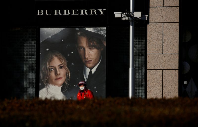 &copy; Reuters. FILE PHOTO: A woman walks past a Burberry boutique in Beijing, China, December 1, 2016. REUTERS/Thomas Peter