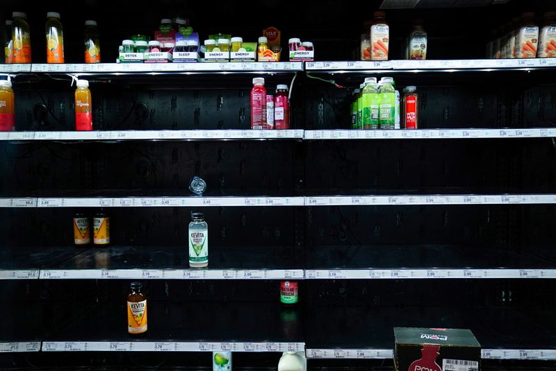 &copy; Reuters. FILE PHOTO: A display case of juice is seen nearly empty at Target as the U.S. continues to experience supply chain disruptions in Washington, U.S., January 9, 2022. REUTERS/Sarah Silbiger