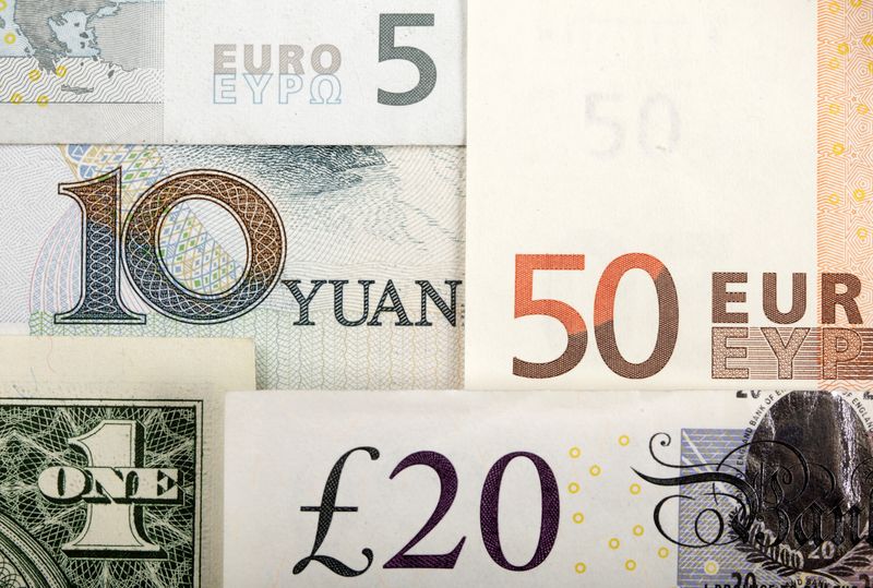 © Reuters. FILE PHOTO - Arrangement of various world currencies including Chinese Yuan, US Dollar, Euro, British Pound, pictured January 25, 2011 REUTERS/Kacper Pempel/Illustration/File Photo