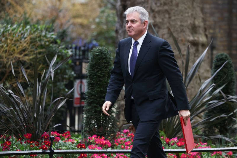 &copy; Reuters. FILE PHOTO: British Secretary of State for Northern Ireland Brandon Lewis walks at Downing Street, in London, Britain, February 21, 2022. REUTERS/Tom Nicholson
