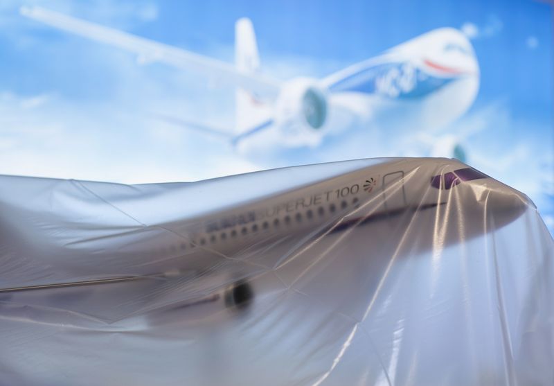 &copy; Reuters. FILE PHOTO: A Russian Sukhoi Superjet SSJ-100 model aircraft sits under plastic sheeting at the 2014 Farnborough Airshow in Farnborough, southern England July 13, 2014. REUTERS/Kieran Doherty 