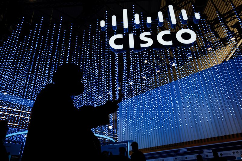 &copy; Reuters. A person passed by Cisco stand at the GSMA's 2022 Mobile World Congress (MWC) in Barcelona, Spain March 1, 2022. REUTERS/Albert Gea