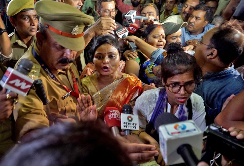&copy; Reuters. FILE PHOTO: Rakhi Singh, Sita Sahu and Laxmi Devi, three of the five petitioners who filed a plea to pray every day before the idol of a goddess and relics inside the Gyanvapi mosque, speak with the media after they leave the mosque in Varanasi, India, Ma