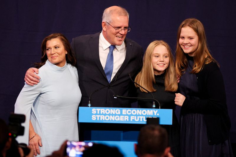 &copy; Reuters. Incumbent Prime Minister Scott Morrison, leader of the Australian Liberal Party, stands next to his wife Jenny and daughters Lily and Abbey as he addresses supporters and concedes defeat in the country's general election in which he ran against Labor Part