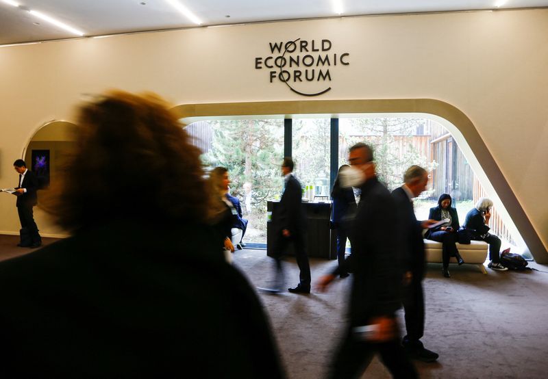 &copy; Reuters. General view of people walking past the World Economic Forum (WEF) logo during the forum in Davos, Switzerland May 23, 2022. REUTERS/Arnd Wiegmann