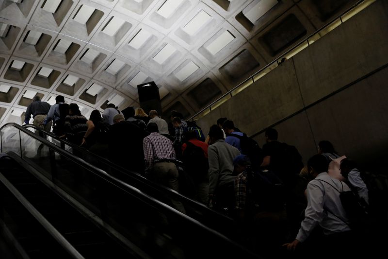 &copy; Reuters. FILE PHOTO: Commuters ride an escalator during the morning rush at the Metro Center subway station in Washington, U.S. June 12, 2017.  REUTERS/Jonathan Ernst