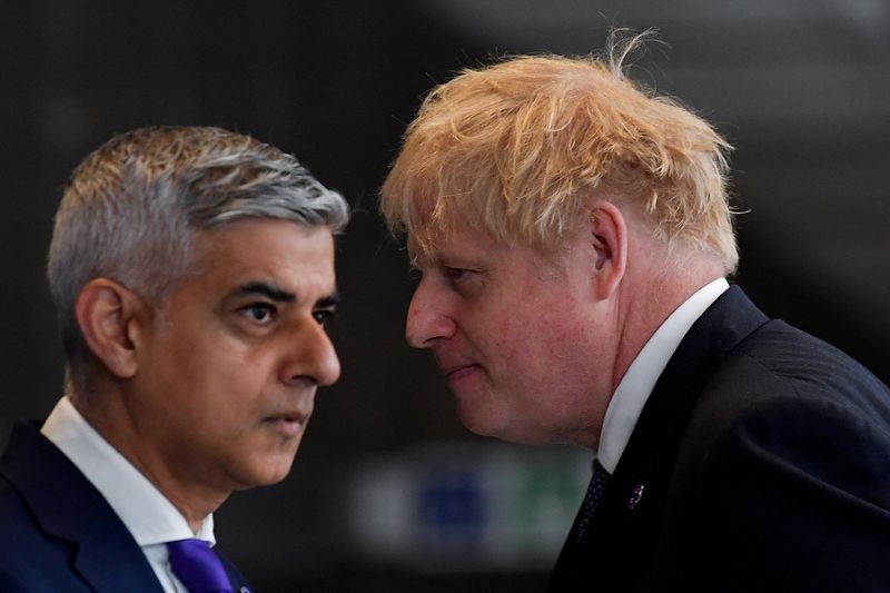 &copy; Reuters. FILE PHOTO: British Prime Minister Boris Johnson and mayor of London Sadiq Khan pass each other during an engagement to mark the completion of the Elizabeth Line at Paddington Station in London, Britain, May 17, 2022. REUTERS/Toby Melville