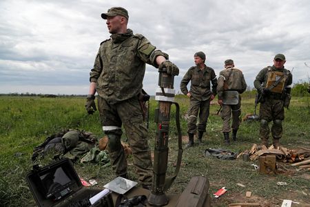 Russian forces battle to surround Ukrainians in east By Reuters