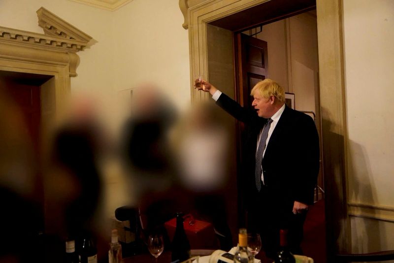 &copy; Reuters. FILE PHOTO: British Prime Minister Boris Johnson gestures in 10 Downing Street during gathering on the departure of a special adviser, in London, Britain November 13, 2020 in this picture obtained from civil servant Sue Gray's report published on May 25, 