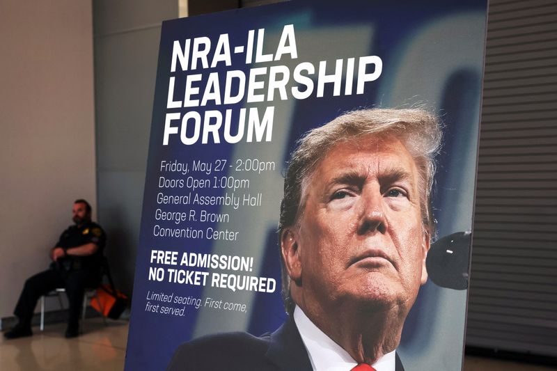 &copy; Reuters. A sign showing former U.S. President Donald Trump, who will be speaking at the NRA-ILA Leadership Forum, stands posted inside the National Rifle Association (NRA) annual convention at the George R. Brown Convention Center in Houston, Texas, U.S., May 26, 