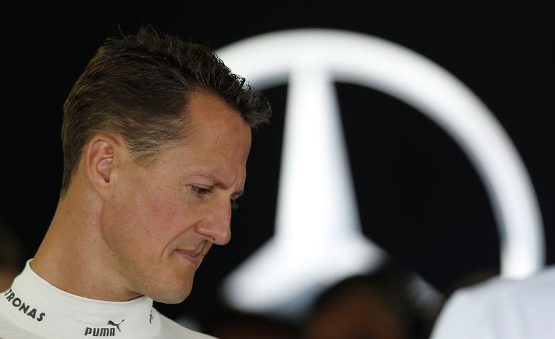 © Reuters. FILE PHOTO: Mercedes Formula One driver Michael Schumacher of Germany stands inside his team garage during the first practice session of the Japanese F1 Grand Prix at the Suzuka circuit October 5, 2012. REUTERS/Kim Kyung-Hoon
