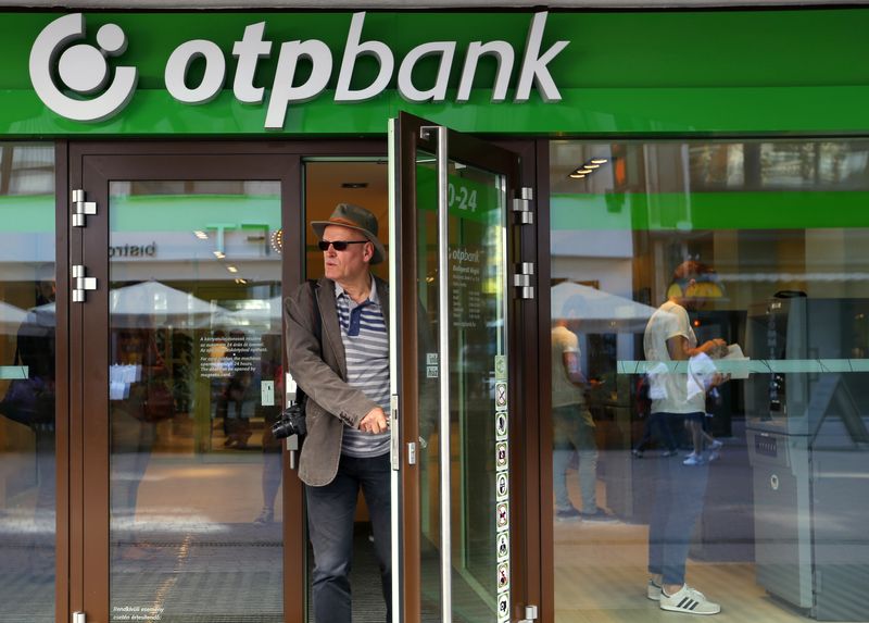&copy; Reuters. FILE PHOTO: A man leaves the OTP Bank branch in the centre of Budapest August 15, 2014. REUTERS/Laszlo Balogh/File Photo