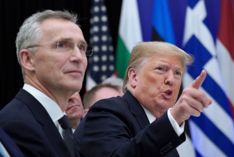 © Reuters. FILE PHOTO: U.S. President Donald Trump gestures next to NATO Secretary General Jens Stoltenberg as they attend a working lunch during the NATO leaders summit in Watford, Britain, December 4, 2019. REUTERS/Kevin Lamarque