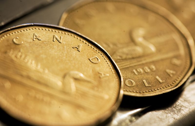 &copy; Reuters. Canadian one dollar coins, also known as loonies, are displayed in Montreal, September 19, 2007. REUTERS/Christinne Muschi/File Photo