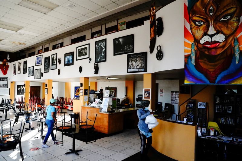 &copy; Reuters. FILE PHOTO: Customers pick up takeout orders inside Coffee Makes You Black, a Black-owned coffee shop on the North Side of Milwaukee, Wisconsin, U.S., November 6, 2020. REUTERS/Bing Guan/File Photo