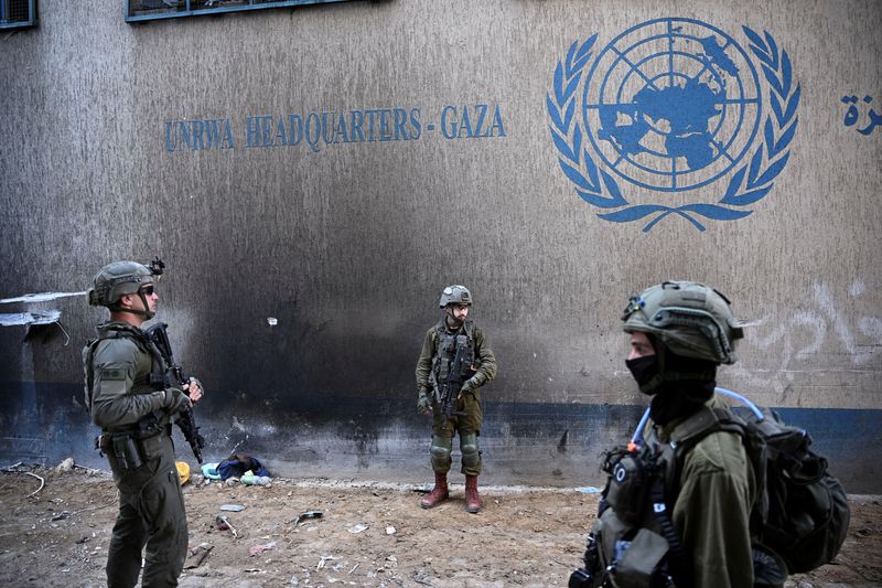 &copy; Reuters. FILE PHOTO: Israeli soldiers operate next to the UNRWA headquarters, amid the ongoing conflict between Israel and the Palestinian Islamist group Hamas, in the Gaza Strip, February 8, 2024. REUTERS/Dylan Martinez