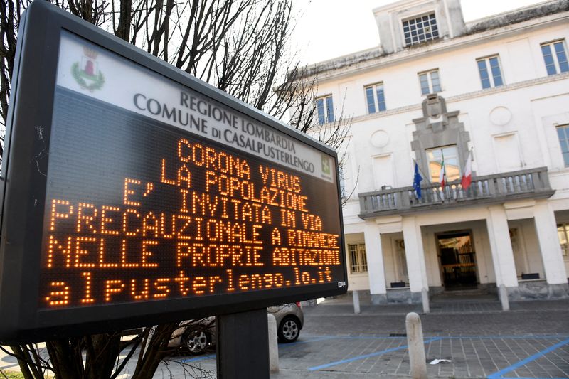 &copy; Reuters. FILE PHOTO: A sign warning people to stay at home is seen in the town of Casalpusterlengo amid a coronavirus outbreak in northern Italy, February 22, 2020. REUTERS/Flavio Lo Scalzo/File Photo