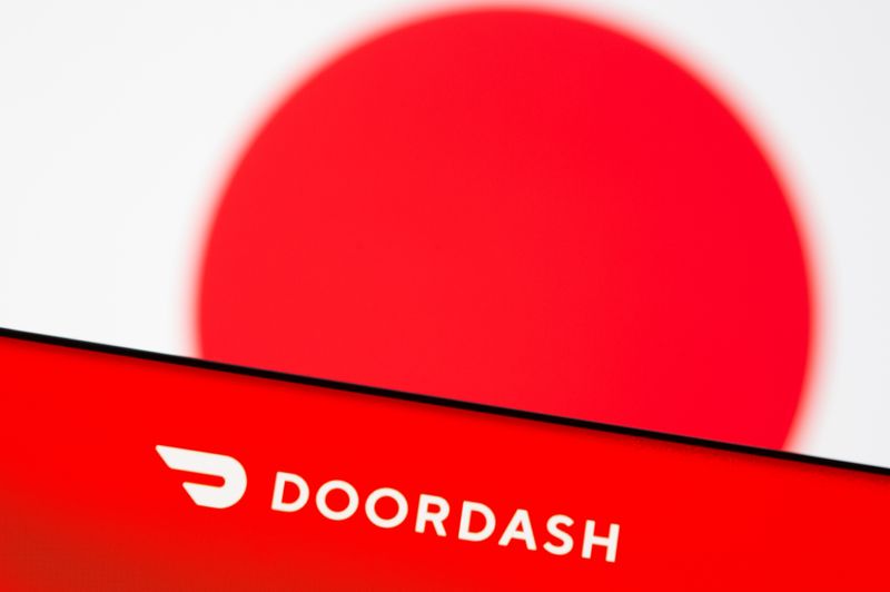 &copy; Reuters. Doordash logo is seen on a smartphone in front of displayed Japan flag in this illustration picture taken June 9, 2021. REUTERS/Dado Ruvic/Illustration