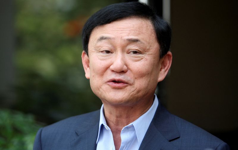 &copy; Reuters. FILE PHOTO: Thailand's former premier Thaksin Shinawatra speaks to journalists outside his home in Dubai, after Puea Thai Party's Yingluck Shinawatra announced her coalition in Bangkok July 4, 2011.REUTERS/Jumana El Heloueh/File Photo