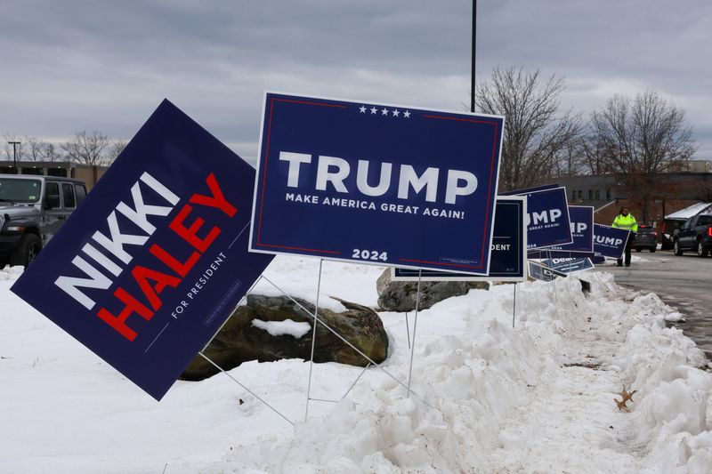 &copy; Reuters. Campaign signs of Republican presidential candidate and former U.S. Ambassador to the United Nations Nikki Haley and Former U.S. President and Republican presidential candidate Donald Trump are seen outside the Londonderry High School during the New Hamps