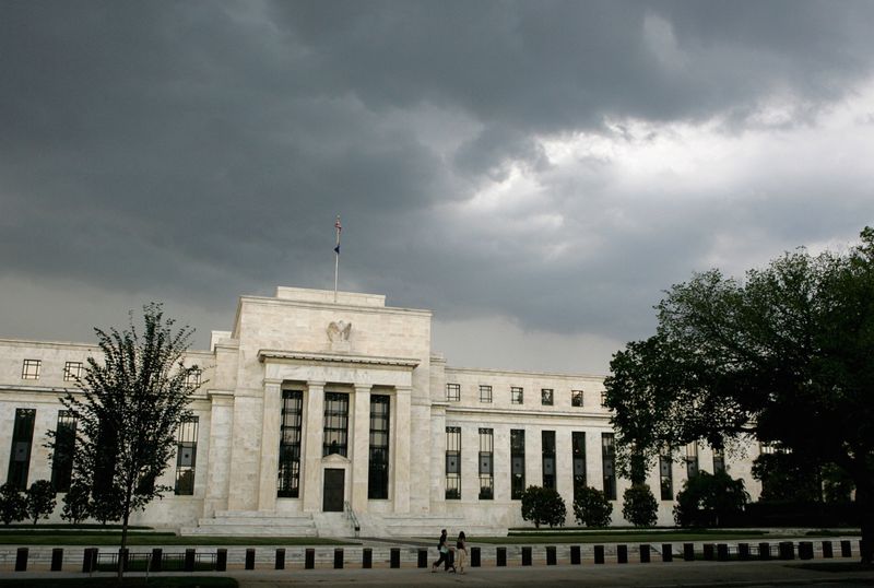 &copy; Reuters. FILE PHOTO: Early summer storm clouds gather over the U.S. Federal Reserve Building before an evening thunderstorm in Washington June 9, 2006. REUTERS/Jim Bourg/File Photo
