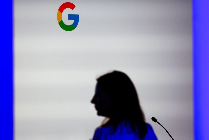 &copy; Reuters. FILE PHOTO: A woman stands in front of a Google logo during the inauguration of a new hub in France dedicated to the artificial intelligence (AI) sector, at the Google France headquarters in Paris, France, February 15, 2024. REUTERS/Gonzalo Fuentes/File P