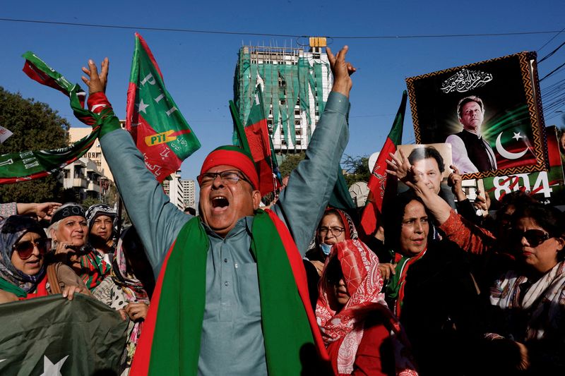 &copy; Reuters. FILE PHOTO: Supporters of former Prime Minister Imran Khan's party, the Pakistan Tehreek-e-Insaf (PTI), chant slogans as they gather during a protest demanding free and fair results of the elections, outside the provincial election commission office in Ka