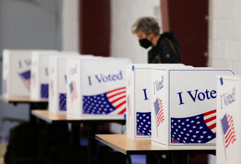 &copy; Reuters. FILE PHOTO: A voter casts her ballot as Democrats hold their first presidential primary in Columbia, South Carolina, U.S., February 3, 2024.  REUTERS/Sam Wolfe