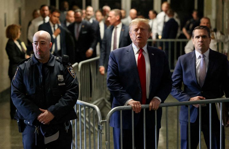 © Reuters. FILE PHOTO: Former U.S. President Donald Trump speaks outside the courtroom on the day of a court hearing on charges of falsifying business records to cover up a hush money payment to a porn star before the 2016 election, in New York State Supreme Court in the Manhattan borough of New York City, U.S., February 15, 2024. REUTERS/Andrew Kelly/File Photo